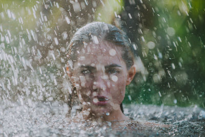 Young woman swimming in pool