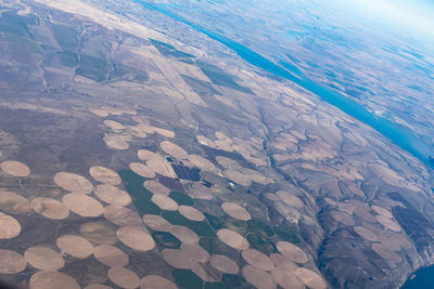 Aerial view of sea seen through airplane window