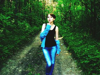 Portrait of young woman in forest