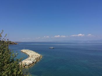 Scenic view of sea against blue sky