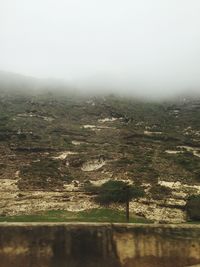 Scenic view of landscape during foggy weather