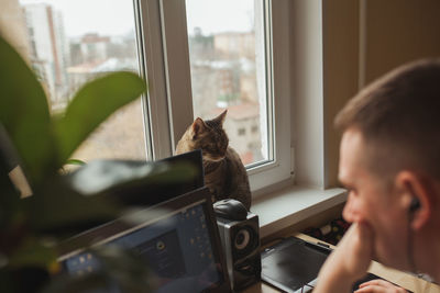 Man using computer while working at home