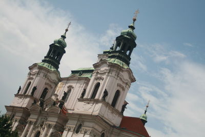 Low angle view of cathedral against cloudy sky