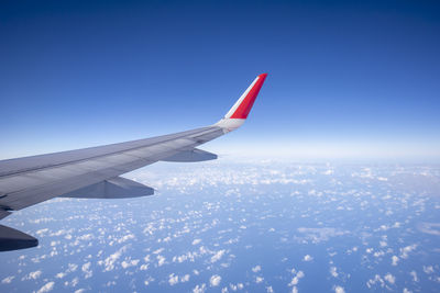 Airplane flying over blue sky