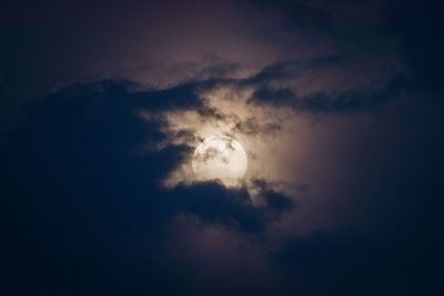 Low angle view of dramatic sky at night