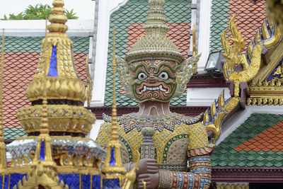Low angle view of guardian statue at wat phra kaeo