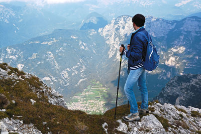 Rear view of man looking at mountains