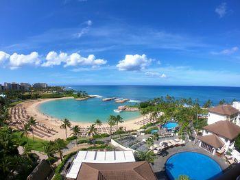 High angle view of swimming pool by sea against sky