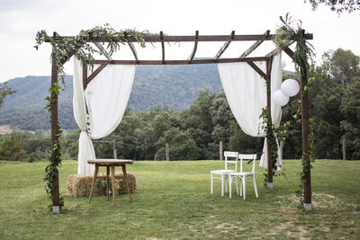 Built structure wedding on field against sky