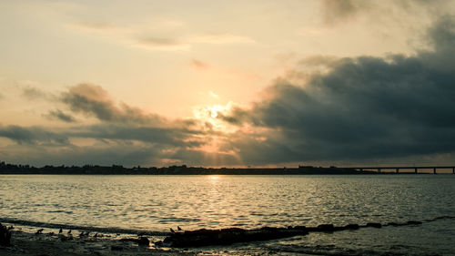 View of calm sea at sunset