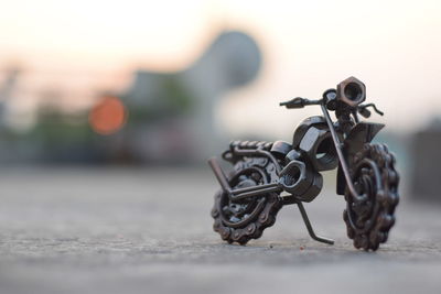 Close-up of toy bicycle on table