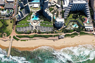 High angle view of swimming pool by buildings in city