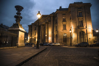 Low angle view of historic building against cloudy sky