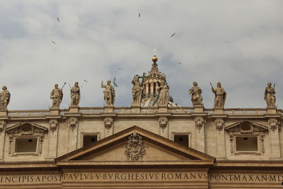 Low angle view of historic building against cloudy sky