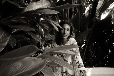 Portrait of young woman standing outdoors