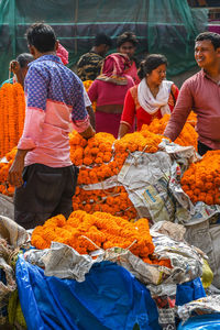 People at market stall