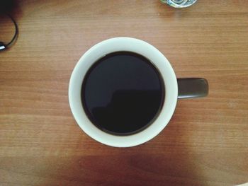 Directly above shot of coffee cup on table