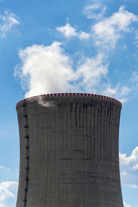 Low angle view of rock against sky