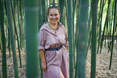 Photo of a young woman in bamboo forest