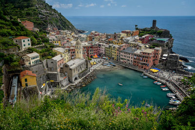 High angle view of townscape by sea