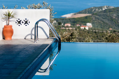 Ladder leading into swimming pool