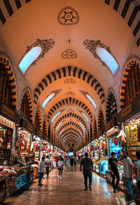 People walking in illuminated market