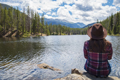 Rear view of woman looking at lake