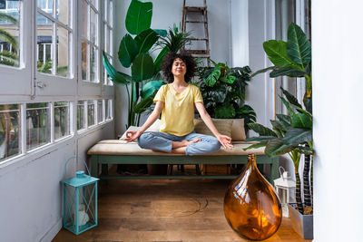 Woman practicing yoga at home