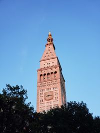 Low angle view of clock tower against sky