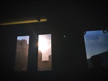 Low angle view of illuminated building against sky