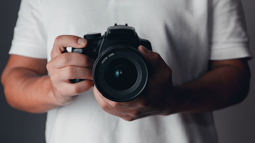 Midsection of man photographing