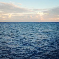 Scenic view of sea against sky at sunset