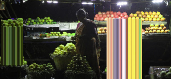 Man wearing multi colored lights at night