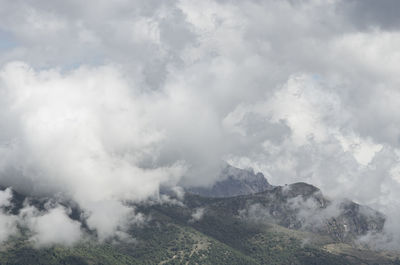 Foggy weather over mountain range top