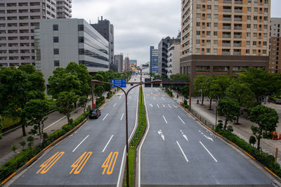 Road amidst buildings in city