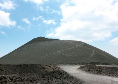 Scenic view of arid landscape against sky