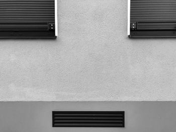 Low angle view of window on wall of building