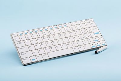 Close-up of computer keyboard against white background