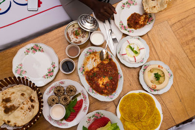 Black woman eating arabic food