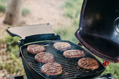 High angle view of coins on barbecue grill