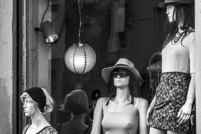 Mannequins displayed outside clothing store