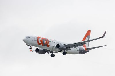 Low angle view of airplane flying in sky