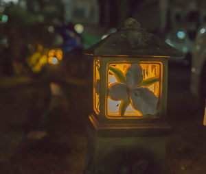 Close-up of yellow flower on glass window