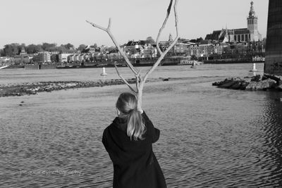 Woman on beach against sea