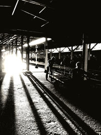 People waiting at railroad station platform