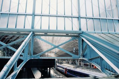 Low angle view of suspension bridge against sky
