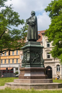 Low angle view of statue against building