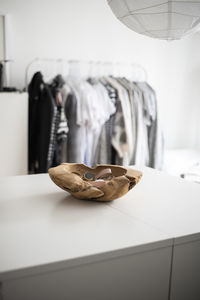 Close-up of shoes hanging on table at home