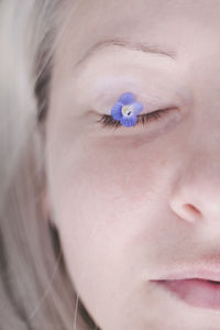 Close-up of girl with flower