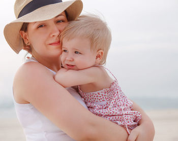 Portrait of mother with baby